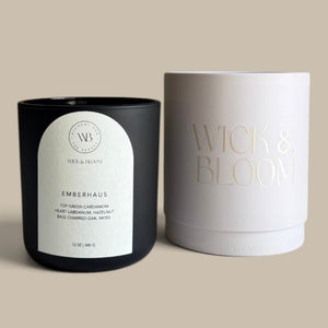 Wick & Bloom Emberhaus candle beside its cream Wick & Bloom gift box