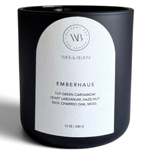 Wick & Bloom Emberhaus candle with green cardamom, charred oak and moss in a matte black vessel